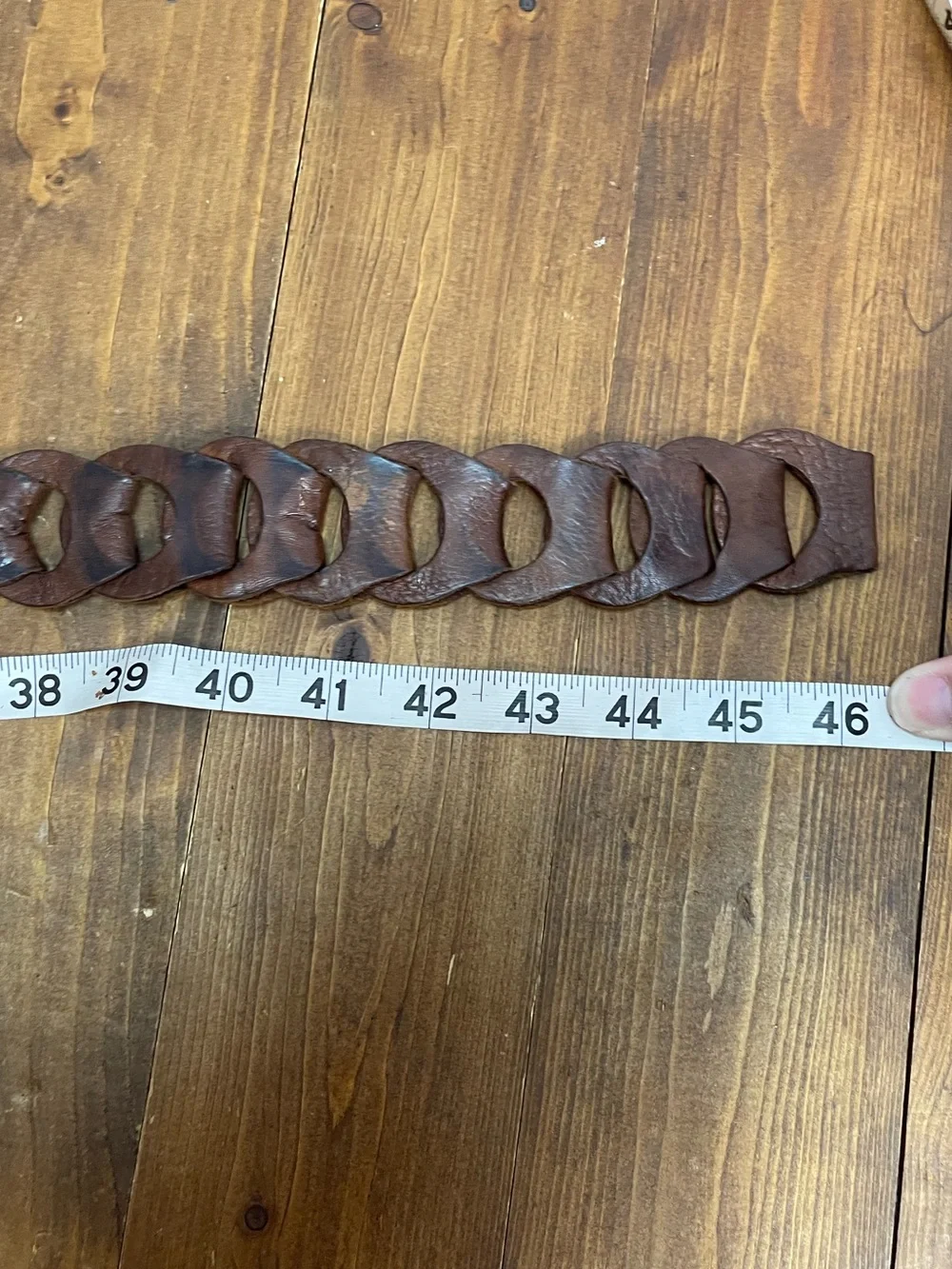 Linked leather belt with silvertone hammered buckle